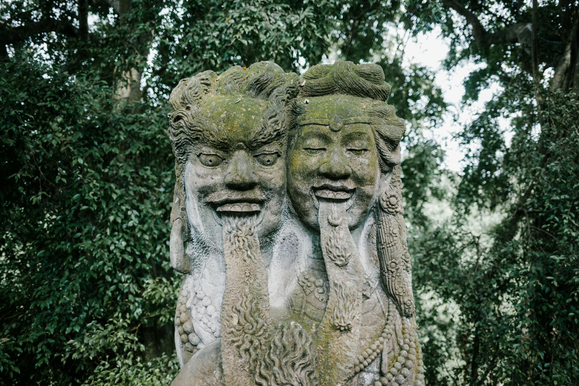 Where is Bali? A Complete Travel Guide to the Island Paradise for Americans 5 stone buddhist figure in ubud monkey forest in bali indonesia