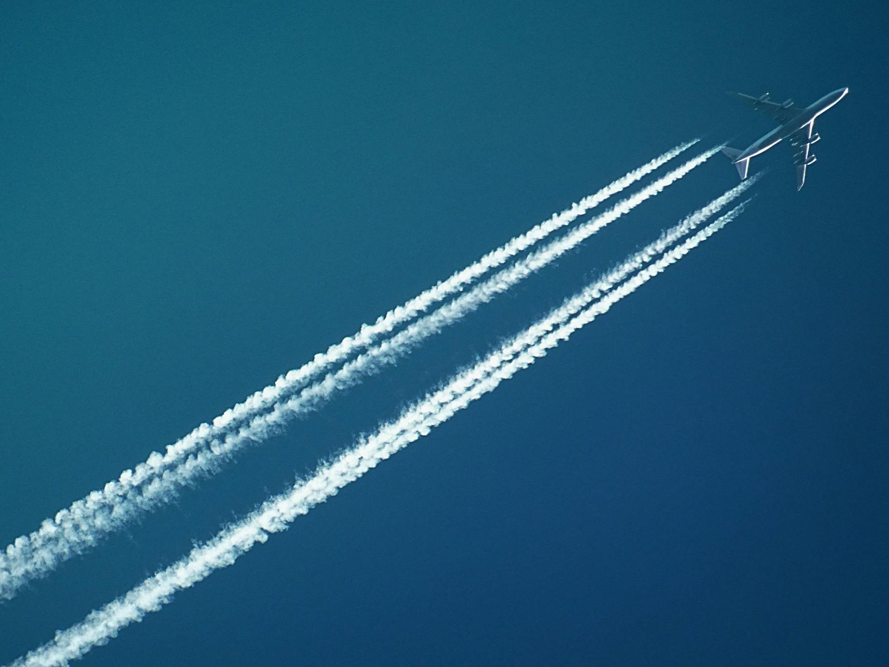 Where is Bali? A Complete Travel Guide to the Island Paradise for Americans 4 white airplane with smoke under blue sky